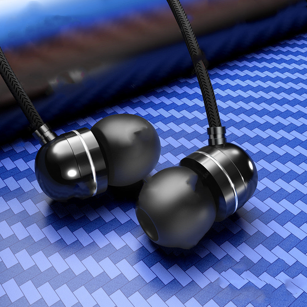 Wired headphones with microphone resting on a textured surface, showcasing their sleek black design.